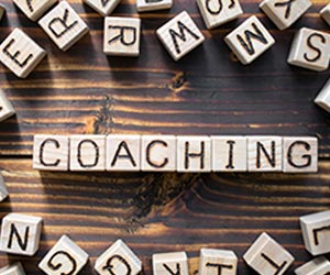 SecondSide - Adobe Stock - 278842702 The word coaching composed of wooden cubes with letters