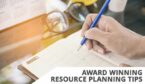 Planner looking at diary with calendar on screen